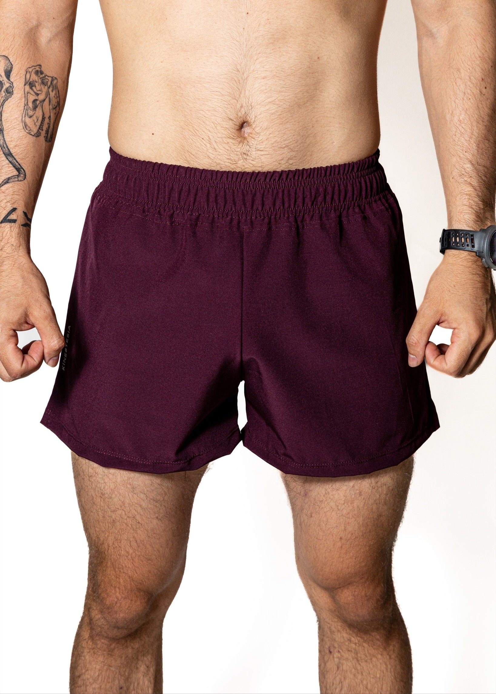 SHORT PÚRPURA DE COMPETENCIA PARA HOMBRE Y MUJER