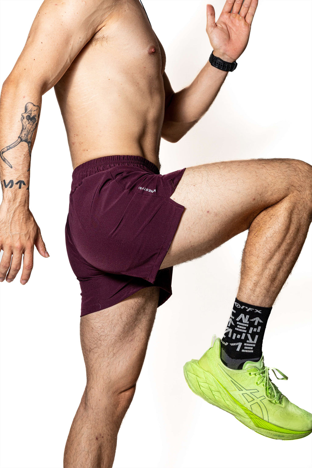 SHORT PÚRPURA DE COMPETENCIA PARA HOMBRE Y MUJER