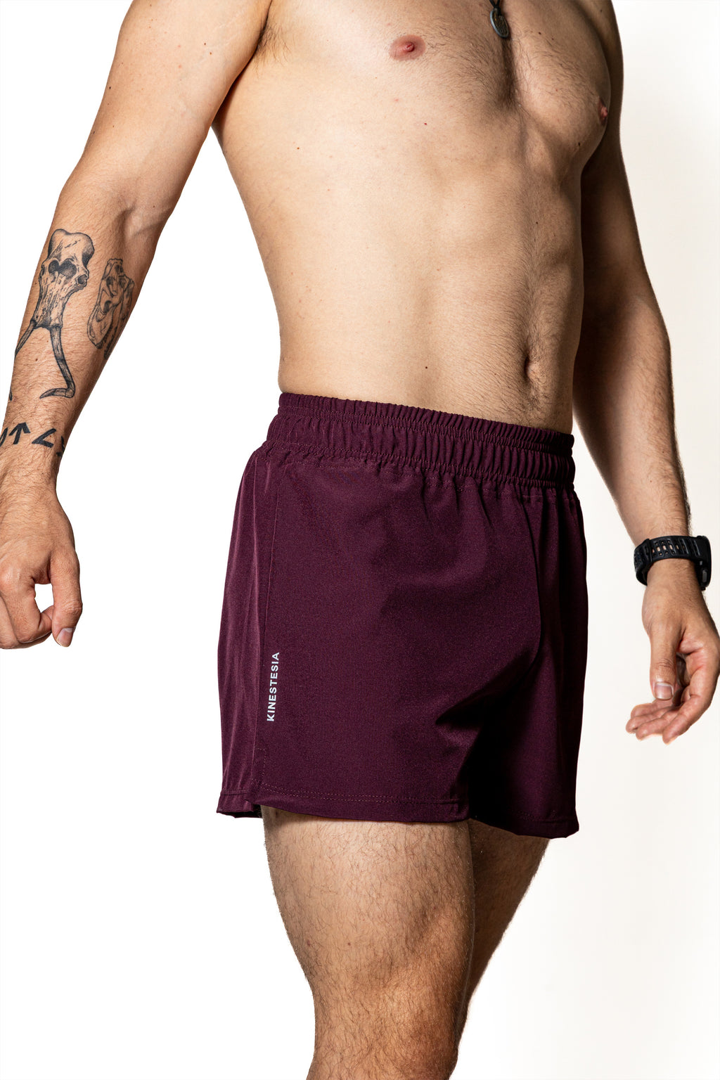 SHORT PÚRPURA DE COMPETENCIA PARA HOMBRE Y MUJER