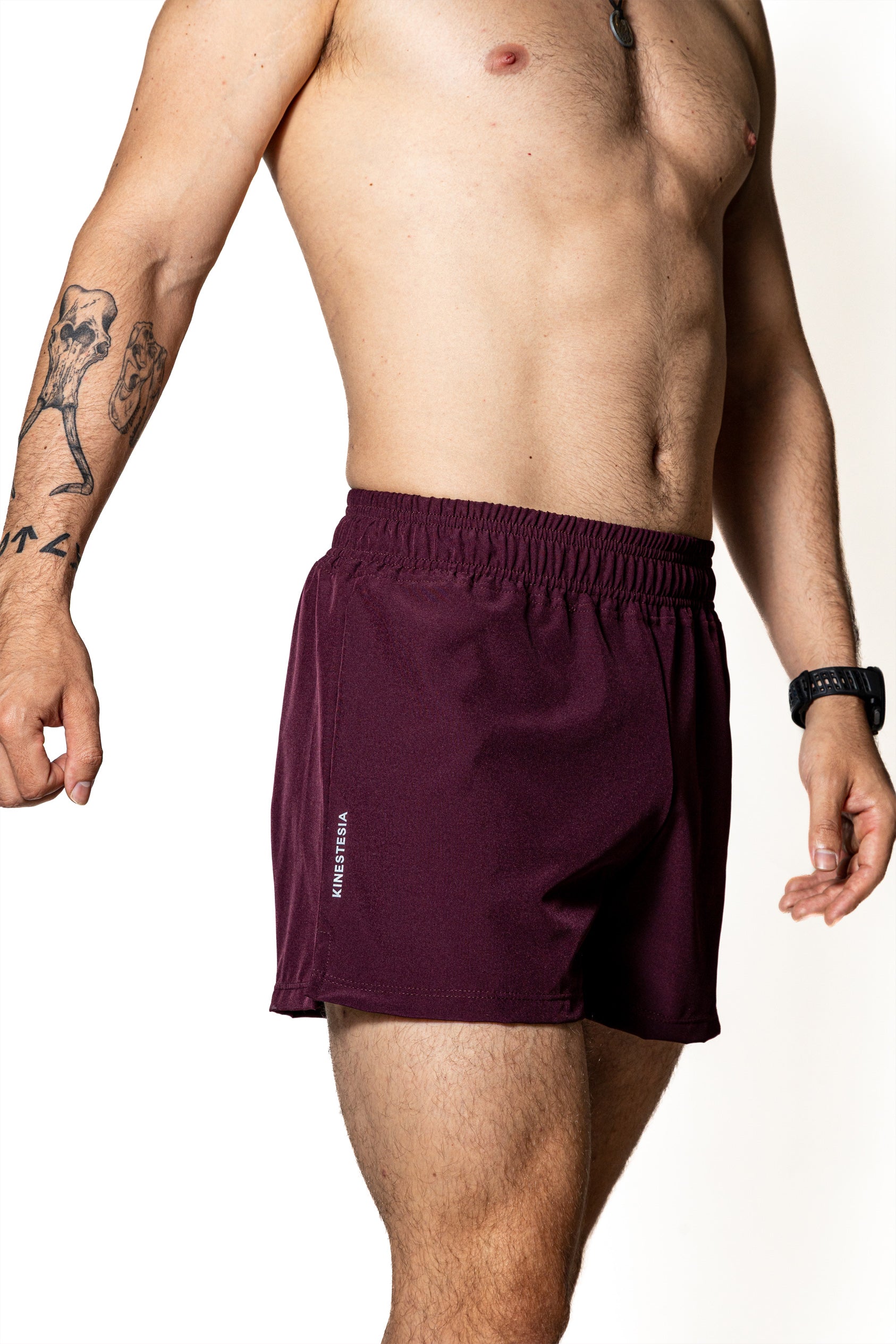 SHORT PÚRPURA DE COMPETENCIA PARA HOMBRE Y MUJER