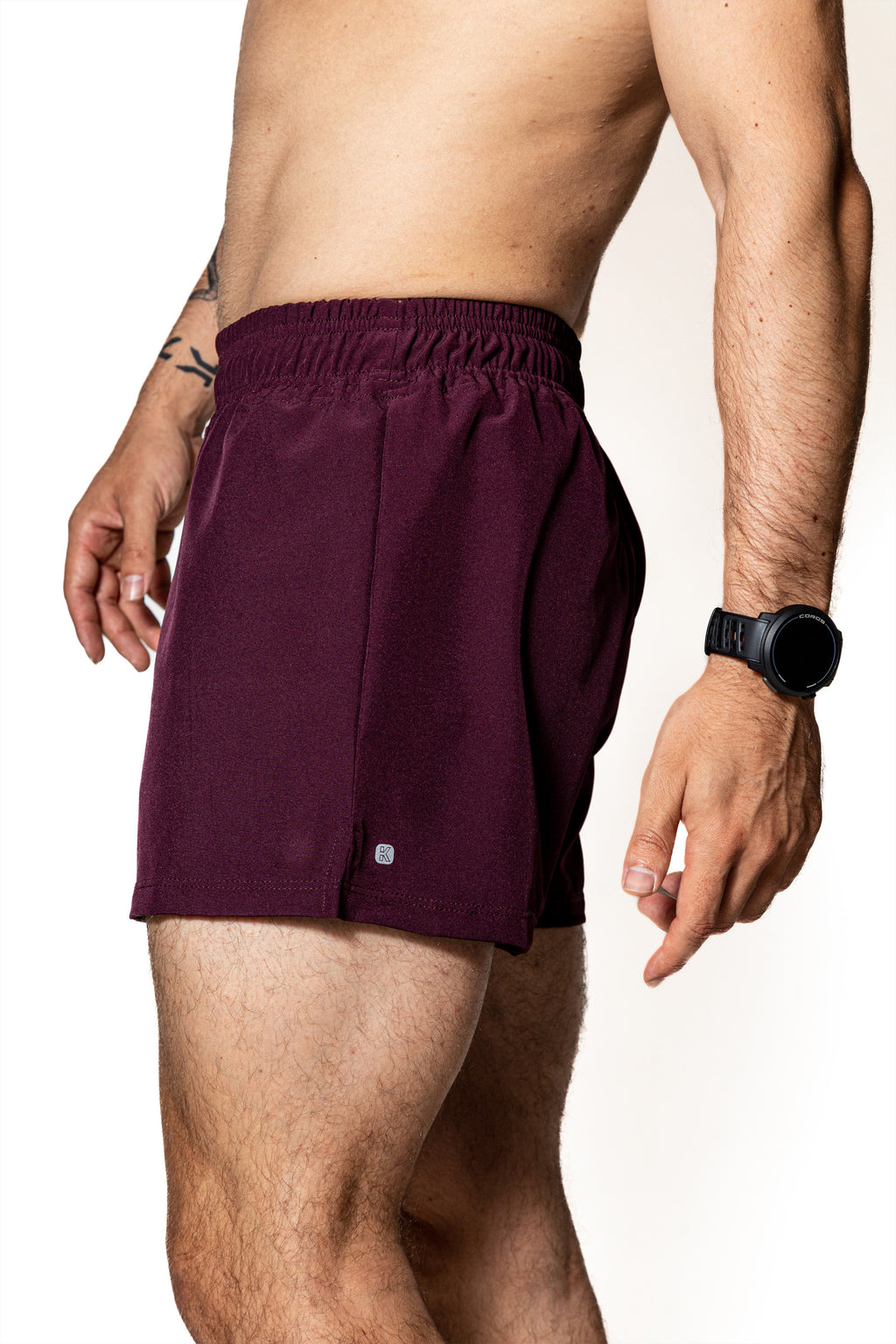 SHORT PÚRPURA DE COMPETENCIA PARA HOMBRE Y MUJER