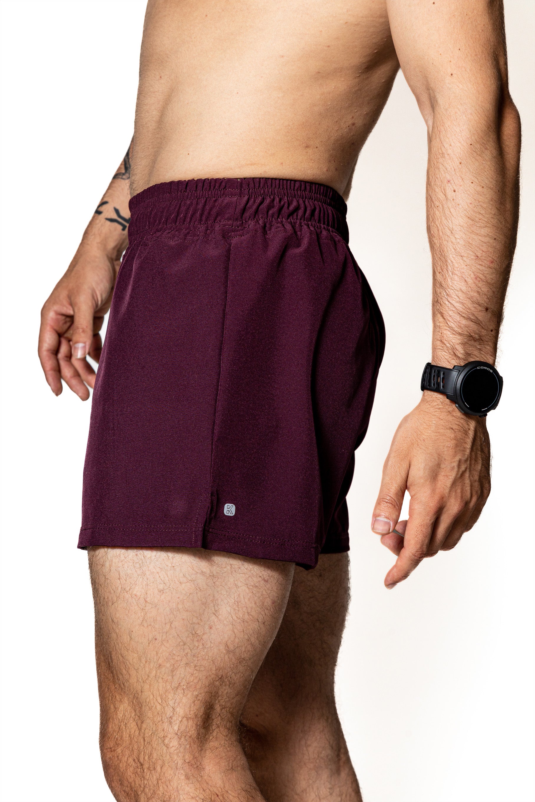 SHORT PÚRPURA DE COMPETENCIA PARA HOMBRE Y MUJER