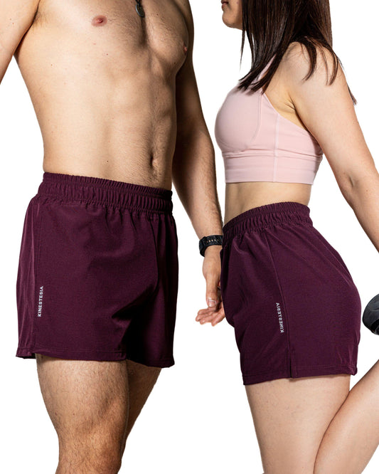 SHORT PÚRPURA DE COMPETENCIA PARA HOMBRE Y MUJER